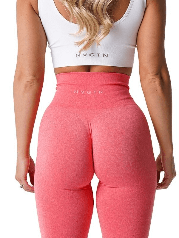Back view of woman wearing tight elastic pink sports leggings perfect for yoga, fitness, and running; showcases high waist fit.