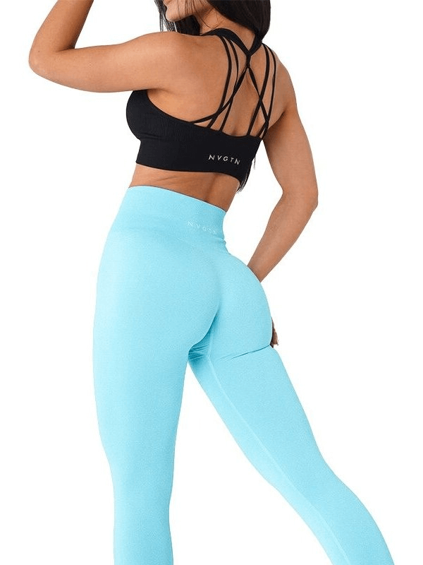 Woman wearing blue tight elastic women's leggings, perfect for yoga and fitness. Made with 93% Nylon and 7% Spandex for flexibility.