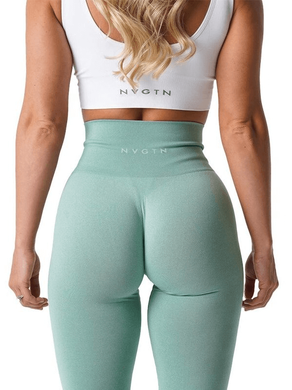 Back view of woman wearing tight elastic sports leggings in light green, perfect for yoga and fitness with high waistband for support.