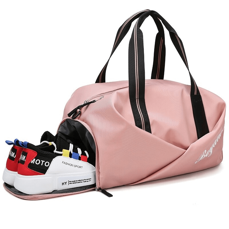 Pink waterproof gym crossbody bag with shoe compartment, perfect for women. Durable nylon, 20-35L capacity. Ideal for sports and fitness.