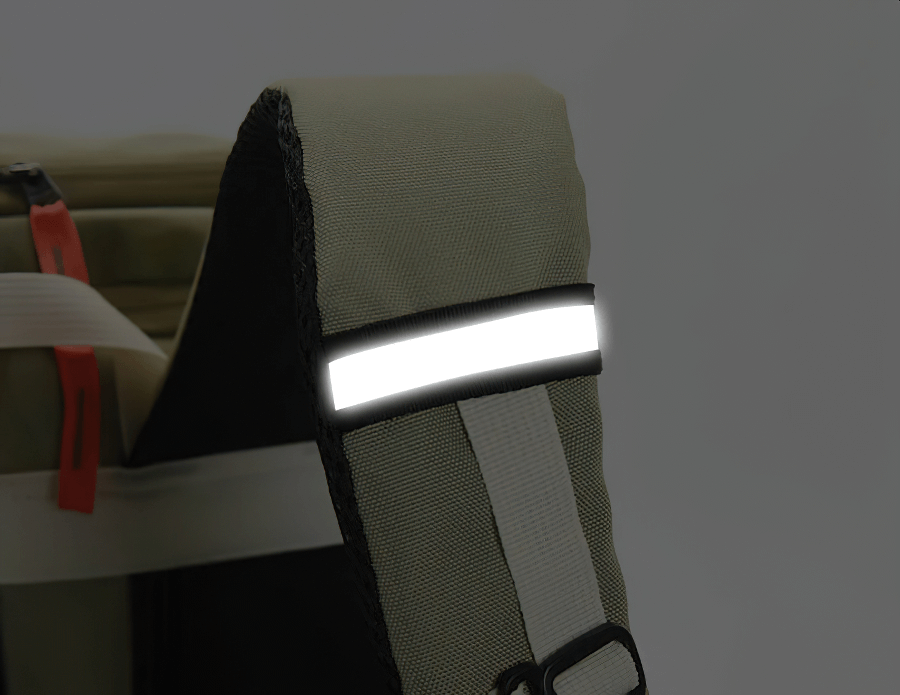 Travel backpack with reflective strap detail, showcasing durable fabric and stylish design for outdoor adventures.