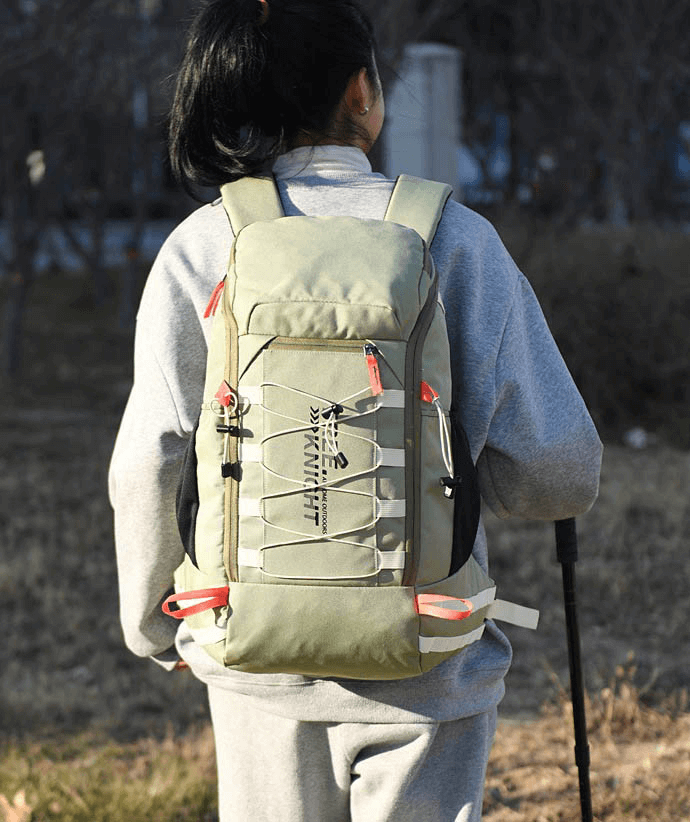 Outdoor adventure with 40L travel backpack, featuring rain cover, jacquard fabric, and easy storage for hiking or travel.