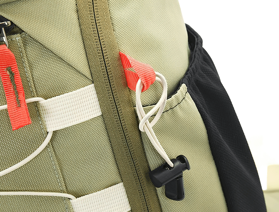 Close-up of a Travel Backpack 40L featuring zipper closure and adjustable straps, designed for outdoor use with rain cover.