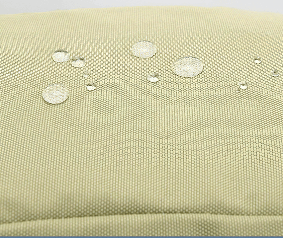 Water droplets on the waterproof fabric of a 40L travel backpack, demonstrating its rain-resistant feature.