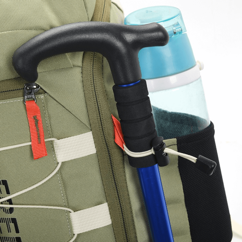 Close-up of travel backpack with hiking pole and water bottle in side pocket. Ideal outdoor gear for adventures.