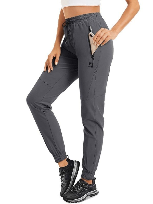 Travel Women's Quick-Drying Grey Pants with Zippered Pockets, ideal for active pursuits. Featuring durable, breathable fabric, SF0134.