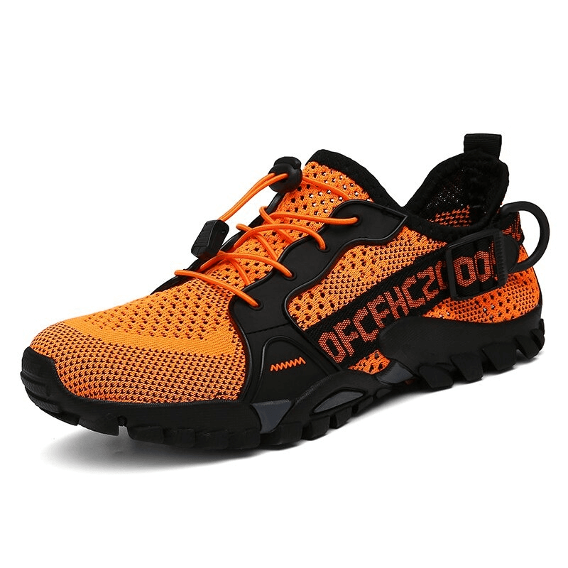 Vibrant orange trekking flexible hiking boot with rubber soles and breathable design, perfect for comfort and performance on the go.