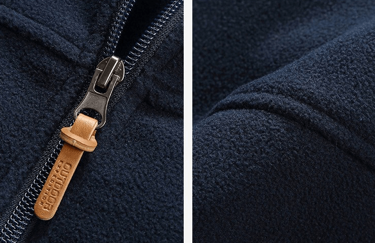 Close-up of navy high-collar zipper fleece jacket showing sturdy zipper and soft fabric texture, perfect for trekking.