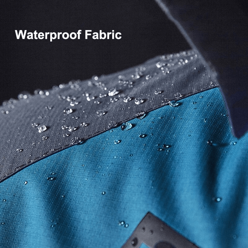 Close-up of Trekking Men's Waterproof Hiking Jacket fabric with water droplets showing water resistance and durability.