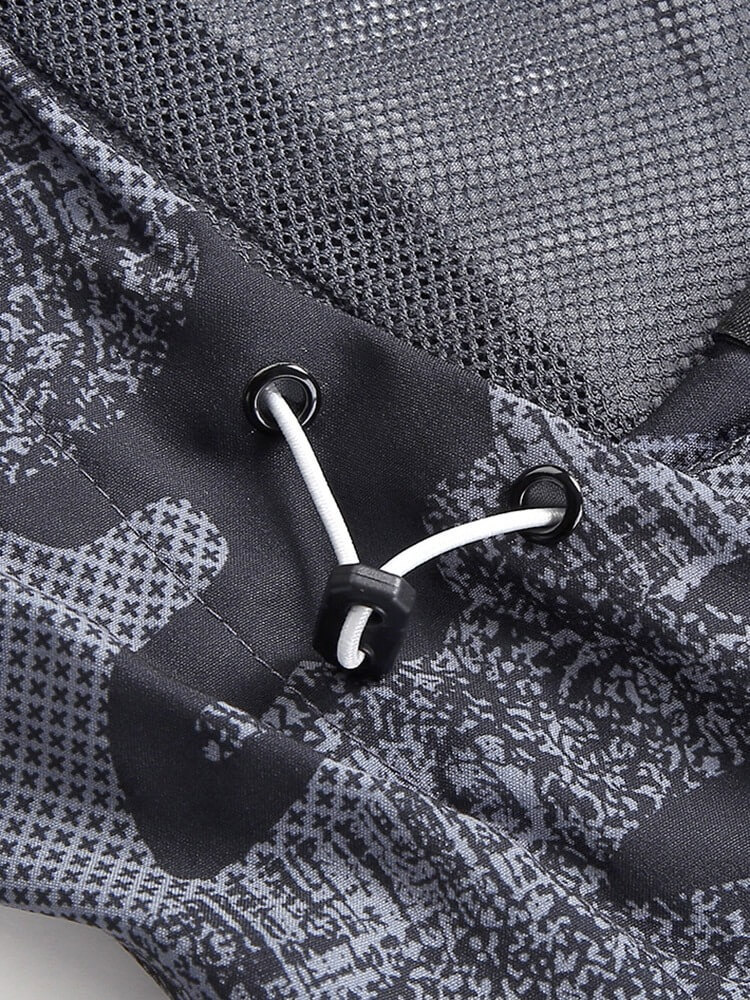 Close-up of trekking windbreaker fabric with drawstring, showcasing waterproof and windproof features for outdoor adventures.