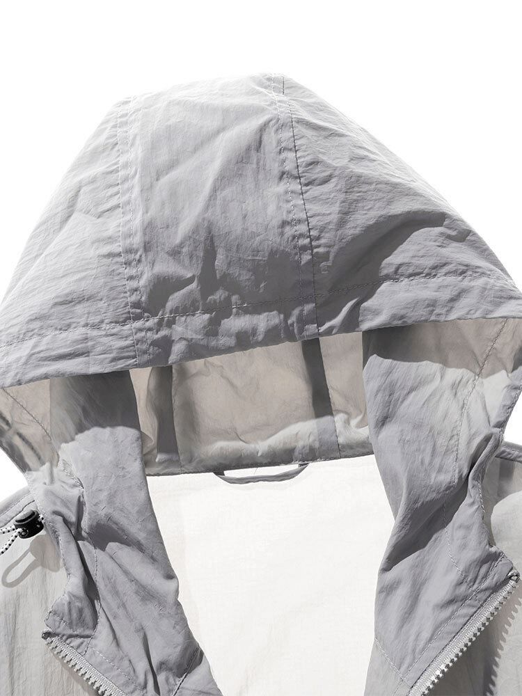 Ultra-Light Multi-Pockets Waterproof Windbreaker with Hood - Stylish protection against wind and rain, solid pattern, zipper closure.