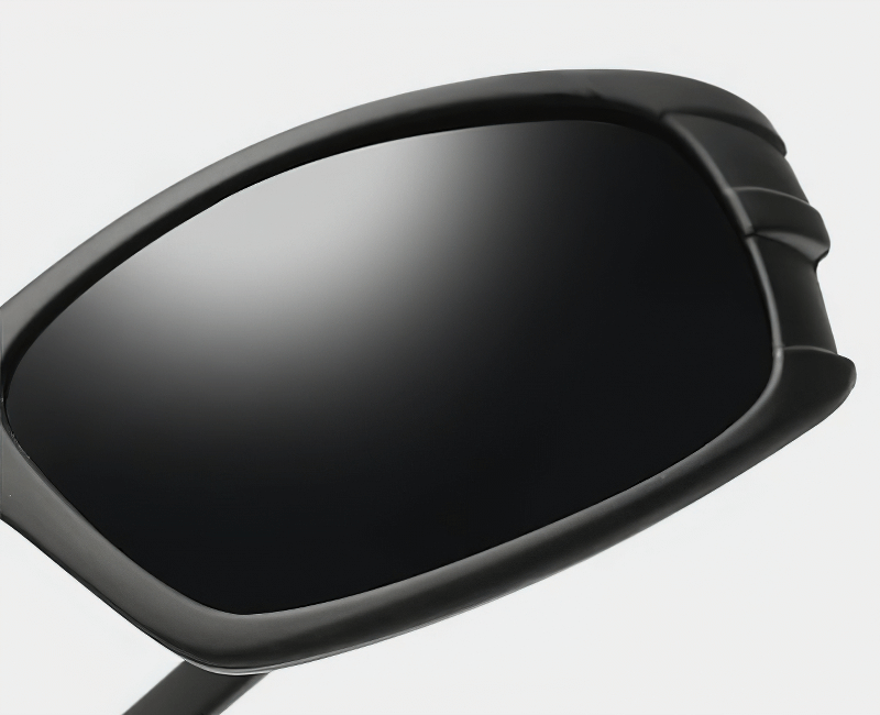 Close-up of sleek black polarized sunglasses with UV400 protection for enhanced driving safety and style.