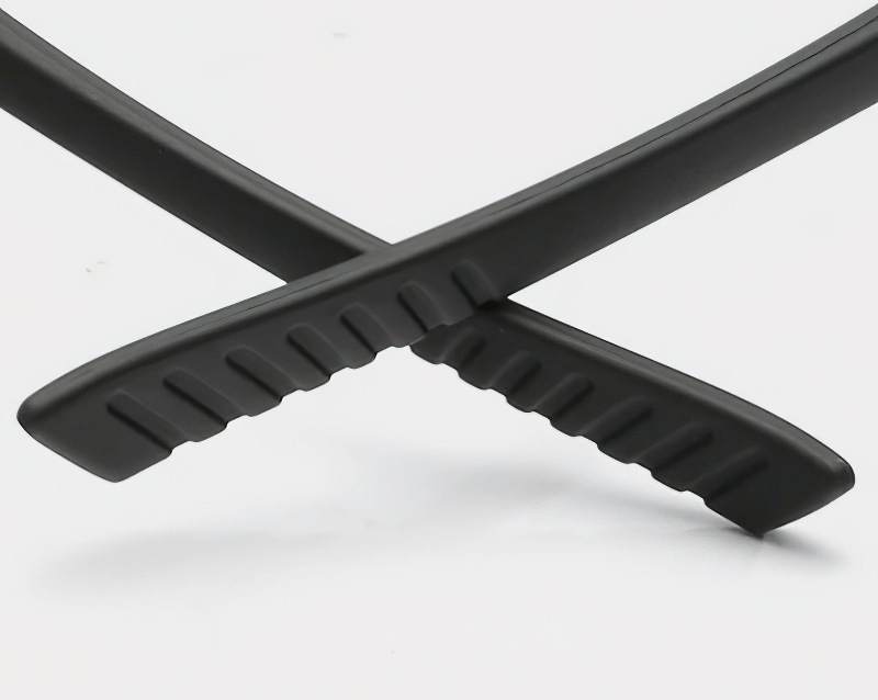 Close-up of black anti-slip rubber temple tips on sunglasses