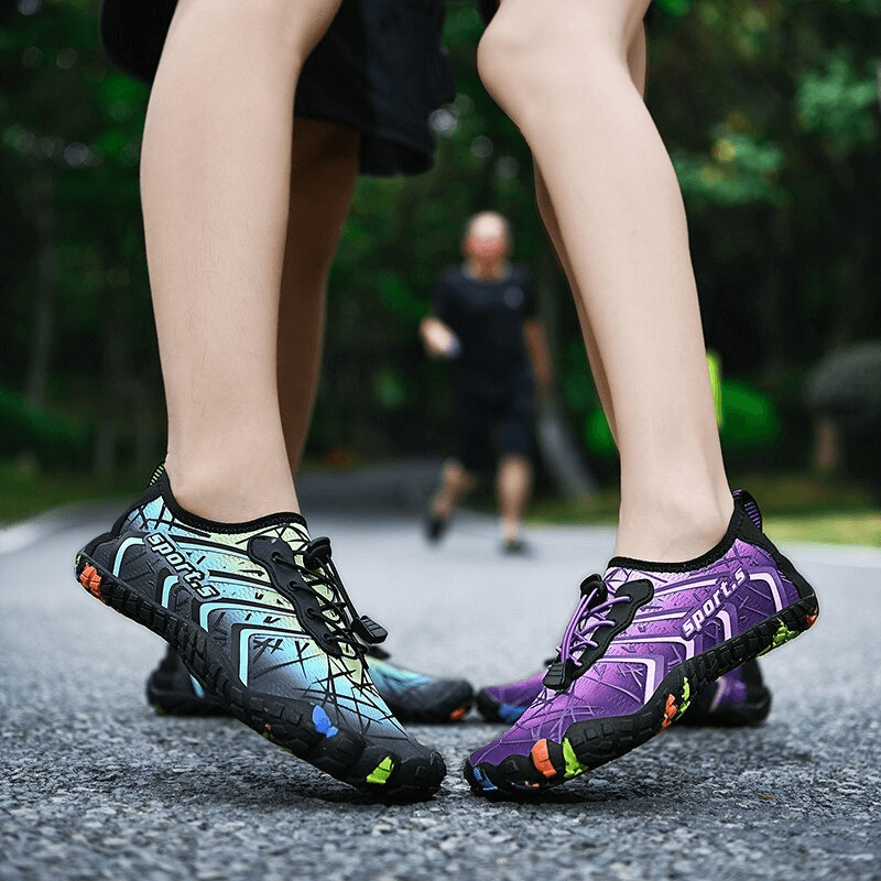 Unisex breathable water shoes with elastic drawstring, perfect for outdoor activities, shown in dynamic duo colors on a path.