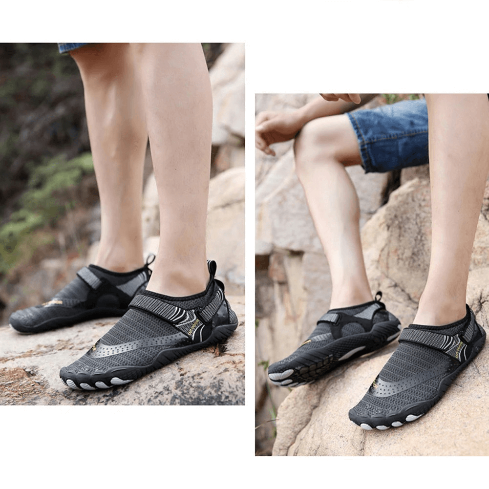 Unisex breathable nonslip aquatic sneakers in black showcased outdoors on rocky surface, perfect for swimming and water sports.