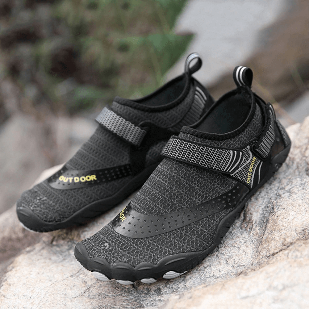 Unisex breathable nonslip aquatic sneakers in black, featuring rubber upper and elastic insole, perfect for swimming activities.