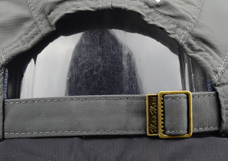 Close-up of adjustable strap on unisex waterproof outdoor baseball cap, perfect for sports and active lifestyles.