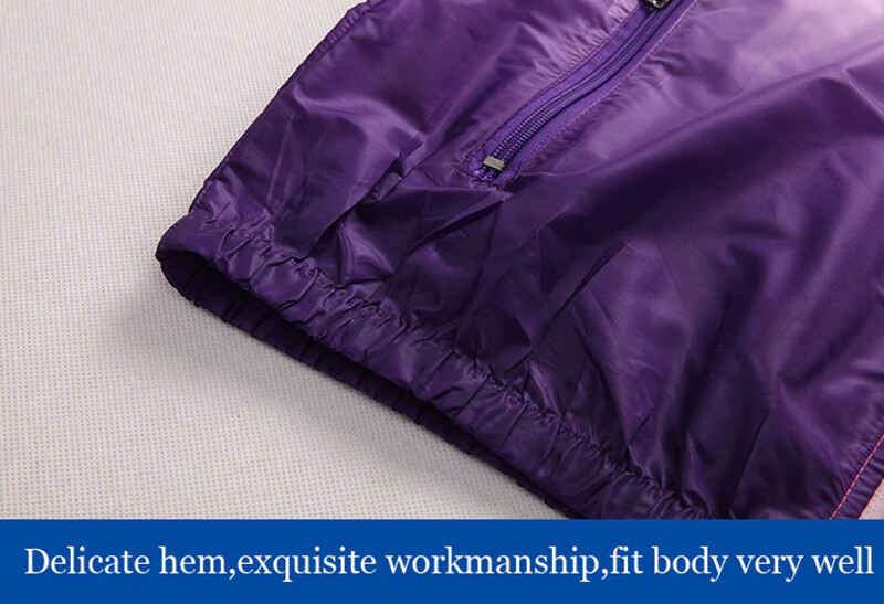 Vibrant purple windbreaker hem showcasing delicate craftsmanship and fitted design.