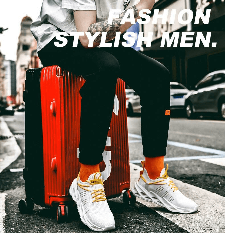 Man sitting on red suitcase wearing white sneakers and orange socks with text 'Fashion Stylish Men.'