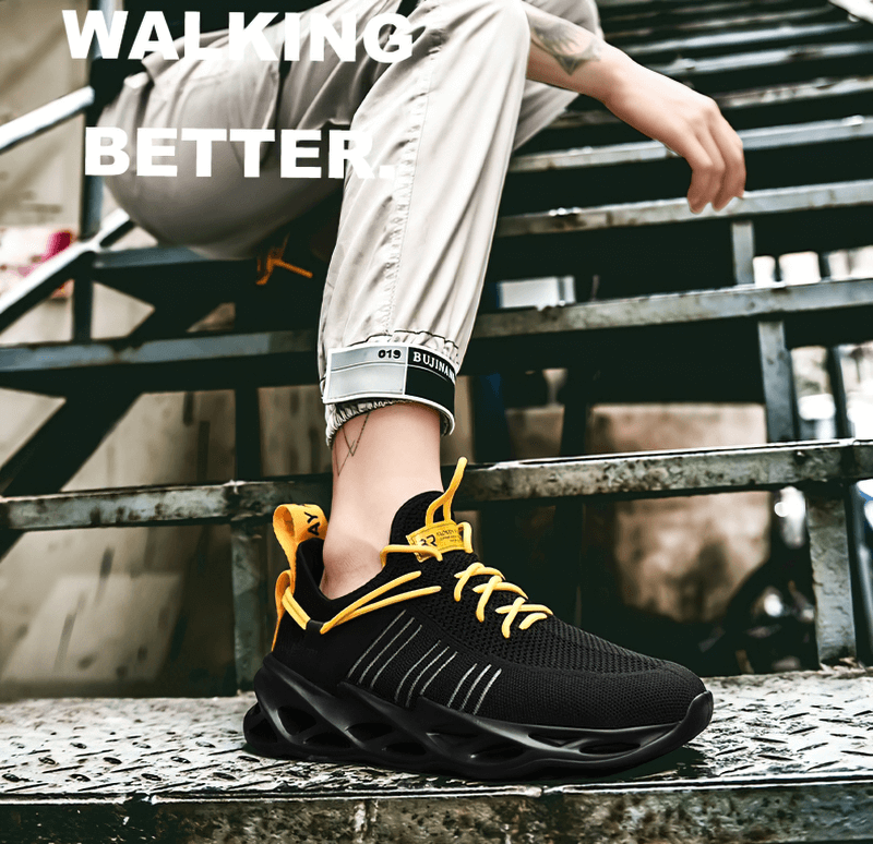 Unisex breathable running shoes with yellow laces on a person sitting on metal stairs.