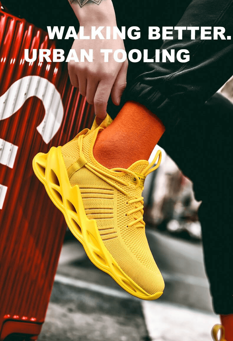 Bright yellow athletic mesh running shoes with lace-up design and vibrant orange socks for enhanced style and comfort.