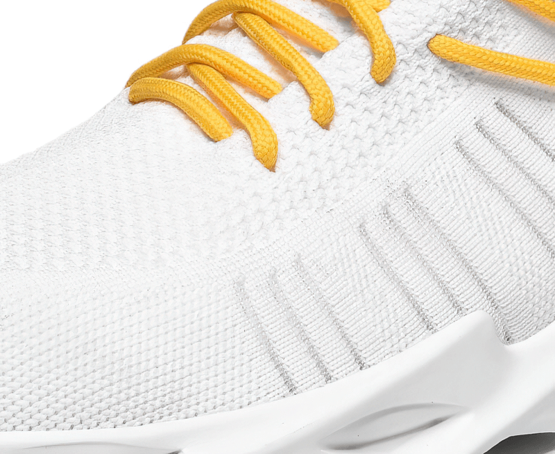 Close-up of white unisex mesh breathable running shoe with yellow laces, featuring a lightweight mesh upper and cushioned EVA outsole.