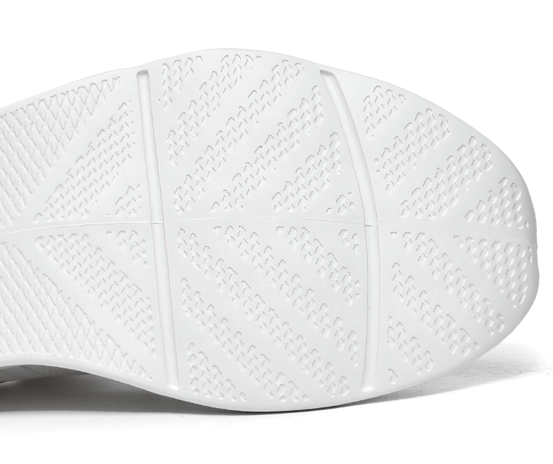 Close-up of the sole of a unisex mesh breathable running shoe showcasing tread pattern and traction.