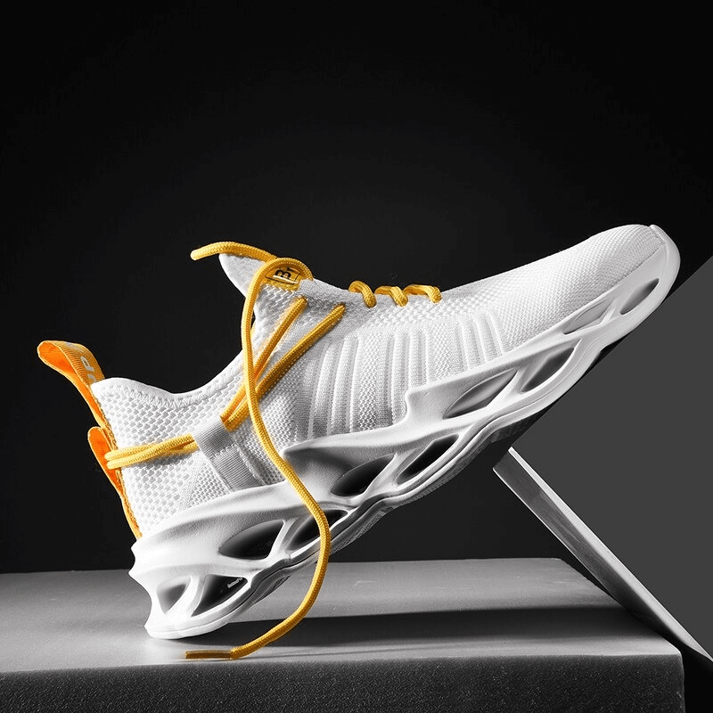 Unisex breathable mesh running shoe with yellow laces on display, showcasing sleek design and lightweight comfort for athletes.