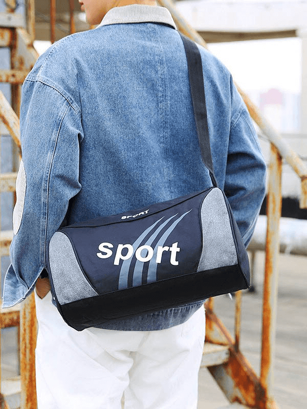 Stylish unisex hiking sports bag with belt in black worn by person outdoors, perfect for adventures.