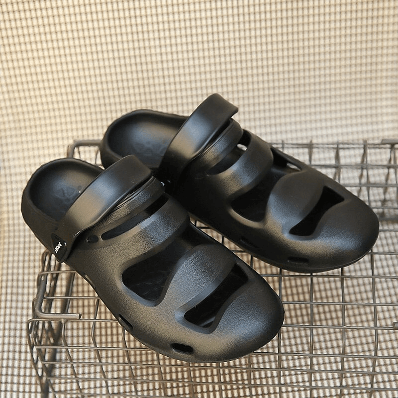 Unisex Soft Hollow Clogs Slippers, sleek black rubber crocs, ideal for outdoor activities. SF0640, lightweight comfort and durability.