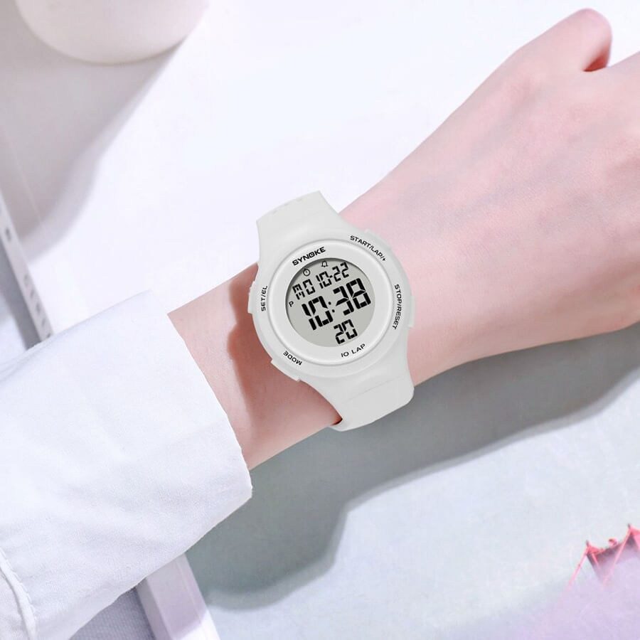 Unisex ultra-thin digital watch with white band on wrist, featuring a waterproof design, LED display, and stopwatch. Model SF0496.