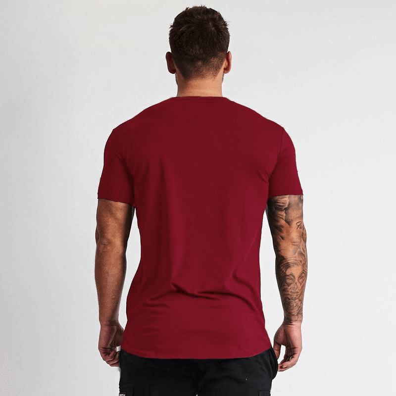 Back view of man wearing a red V-neck short sleeve slim fit fashion T-shirt, perfect for casual gym clothing. Model shows muscle fit style.