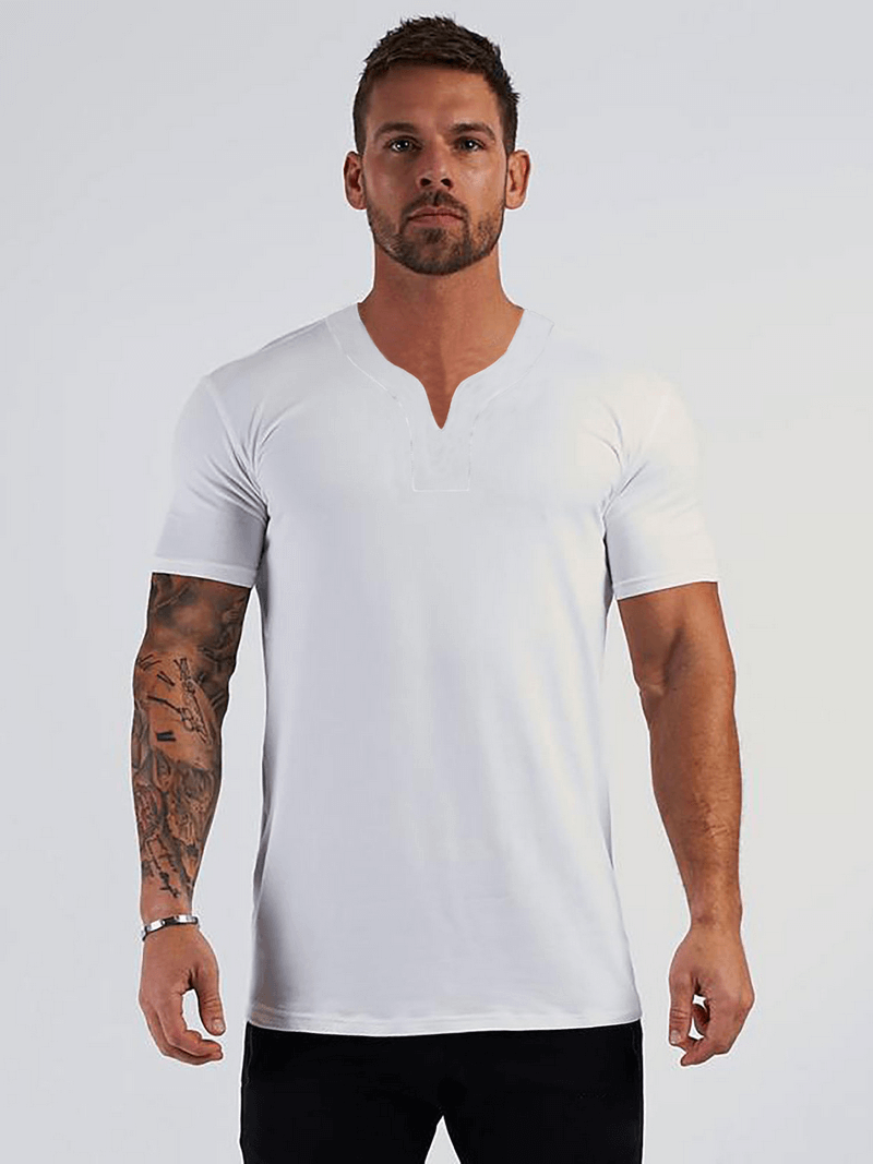 Model wearing a white V-Neck short sleeves slim fit fashion T-shirt, casual gym clothing ideal for men, made from comfortable cotton.