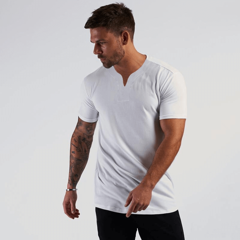 Man wearing a white V-neck short sleeve slim fit T-shirt, perfect for casual or gym wear.