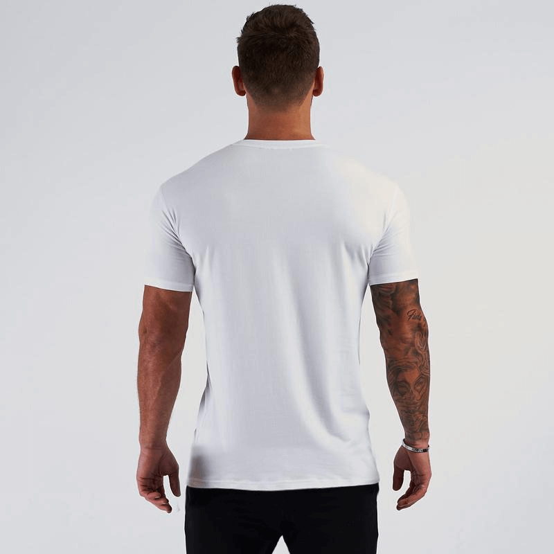 Back view of man in white slim fit V-Neck short sleeves t-shirt, ideal for casual gym style. Model wearing SF1230, relaxed fit.