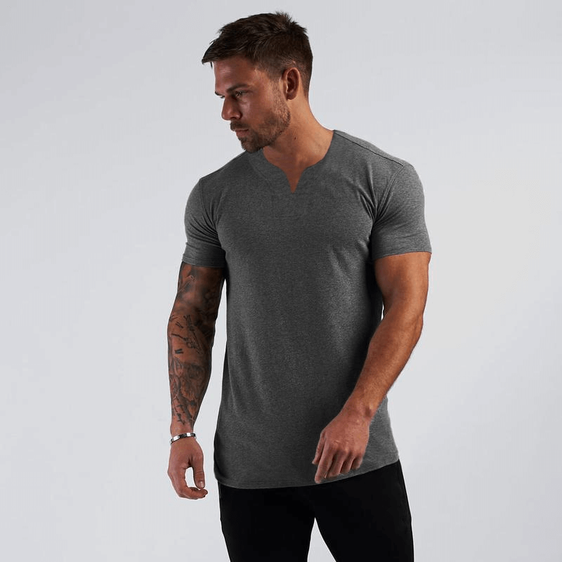 Model wearing V-Neck Short Sleeves Slim Fit T-shirt, perfect for casual gym clothing, made of breathable 100% cotton.