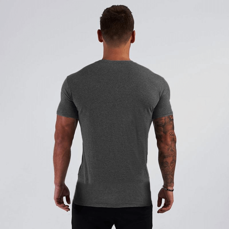 Back view of man wearing a grey V-Neck Slim Fit T-shirt, showcasing casual gym style with short sleeves, ideal for fitness.