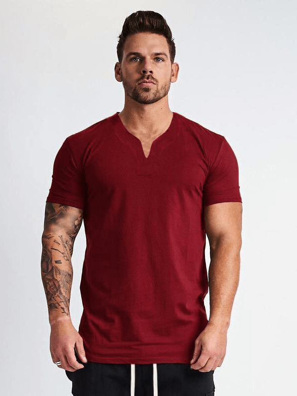 Man wearing a stylish red V-Neck Slim Fit T-shirt, perfect for gym and casual wear.