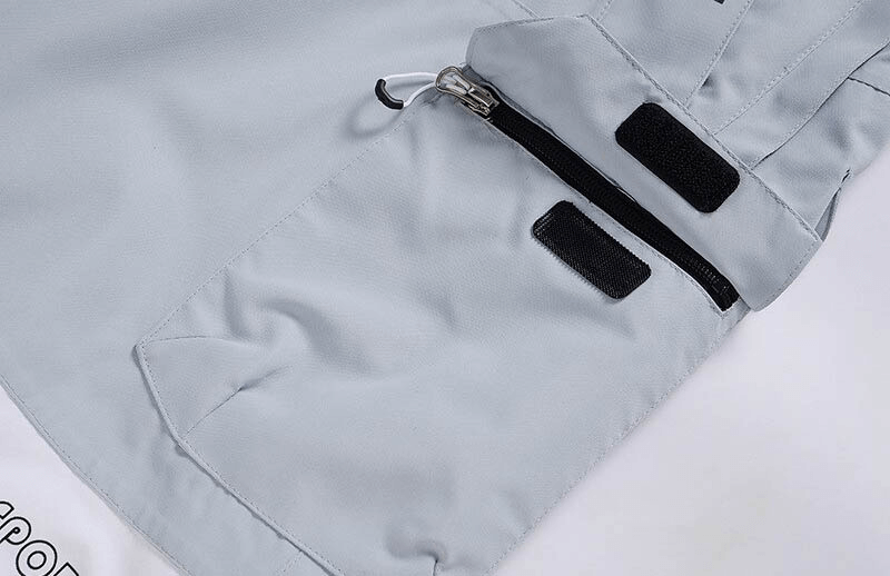 Close-up of warm waterproof snowboarding pants with zipper and strap, made of soft polyester, perfect for winter skiing.