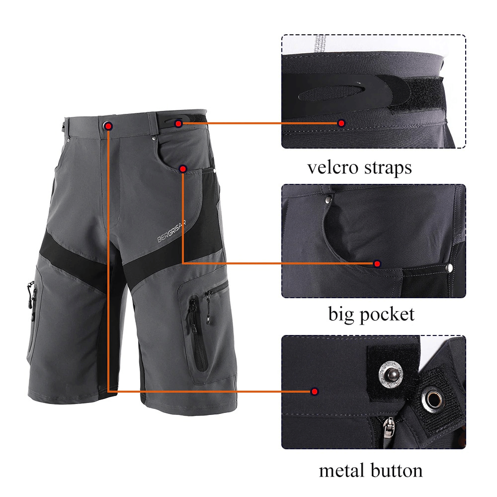 Gray water-resistant mountain bike shorts with velcro straps, big pocket, and metal button, featuring reflective detailing for safety.