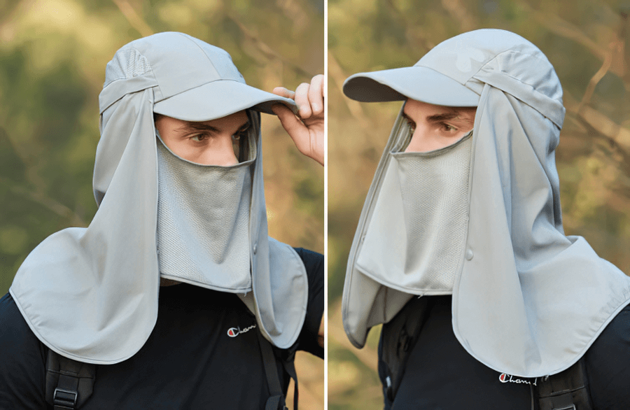 Man wearing waterproof adjustable sun hat with neck flap for hiking in nature.