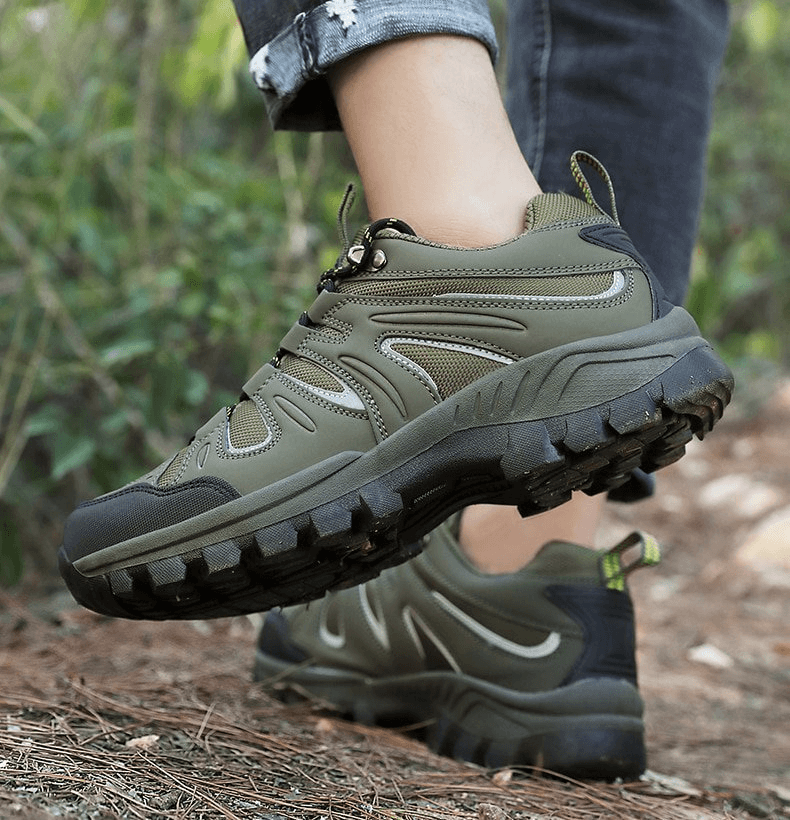 Men's waterproof anti-slip trekking shoes SF0753 on forest trail, showcasing durable rubber outsole and breathable nylon design.