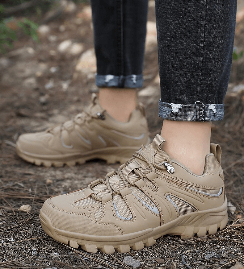 Men's waterproof anti-slip trekking shoes in tan, designed for outdoor adventures. Breathable nylon upper with a secure lace-up closure.
