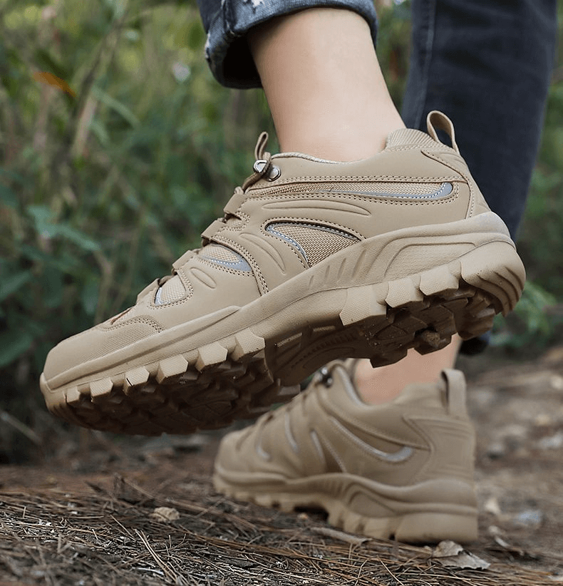 Alt Tag: Beige waterproof anti-slip trekking shoes for men in action on outdoor trail, featuring sturdy grip and breathable design.