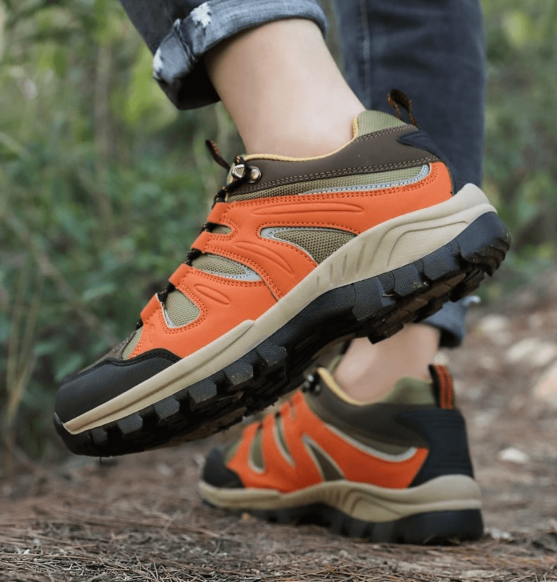 Orange waterproof anti-slip men's trekking shoes, SF0753 model, with durable rubber outsole and breathable nylon for outdoor adventures.