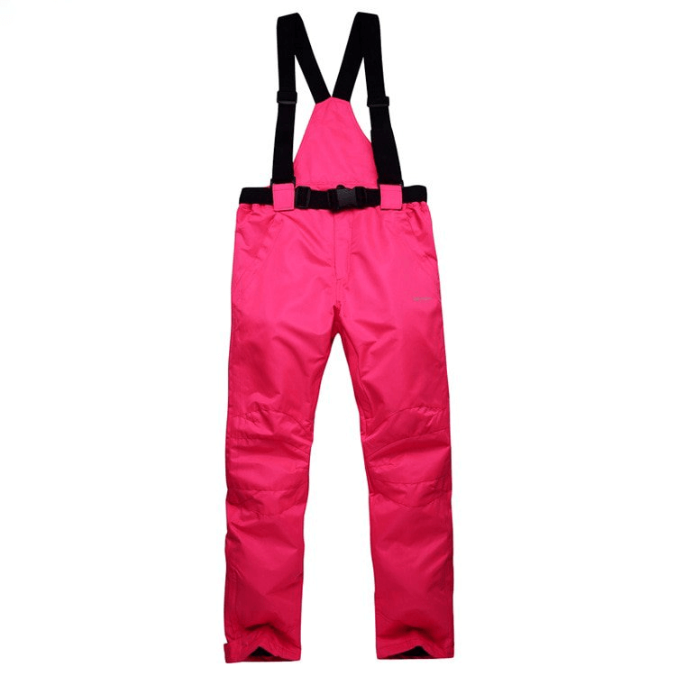 Bright pink waterproof breathable ski pants with black suspenders and waistband.