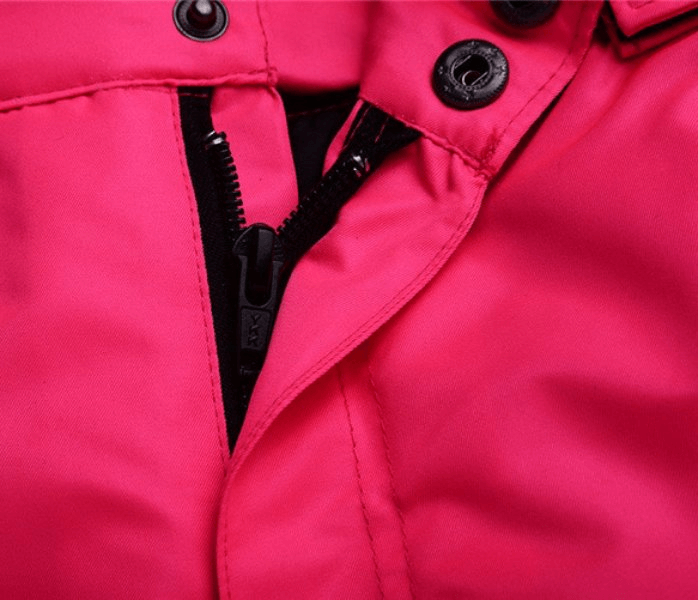 Close-up of pink waterproof breathable ski pants with zipper fly from SF0798, designed for comfort and warmth in winter sports.