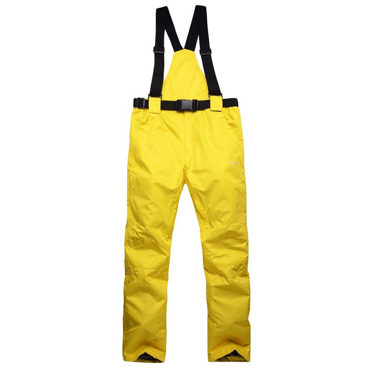 Yellow waterproof breathable insulated ski pants with suspenders, nylon-polyester blend, full-length with zipper fly for snow protection.