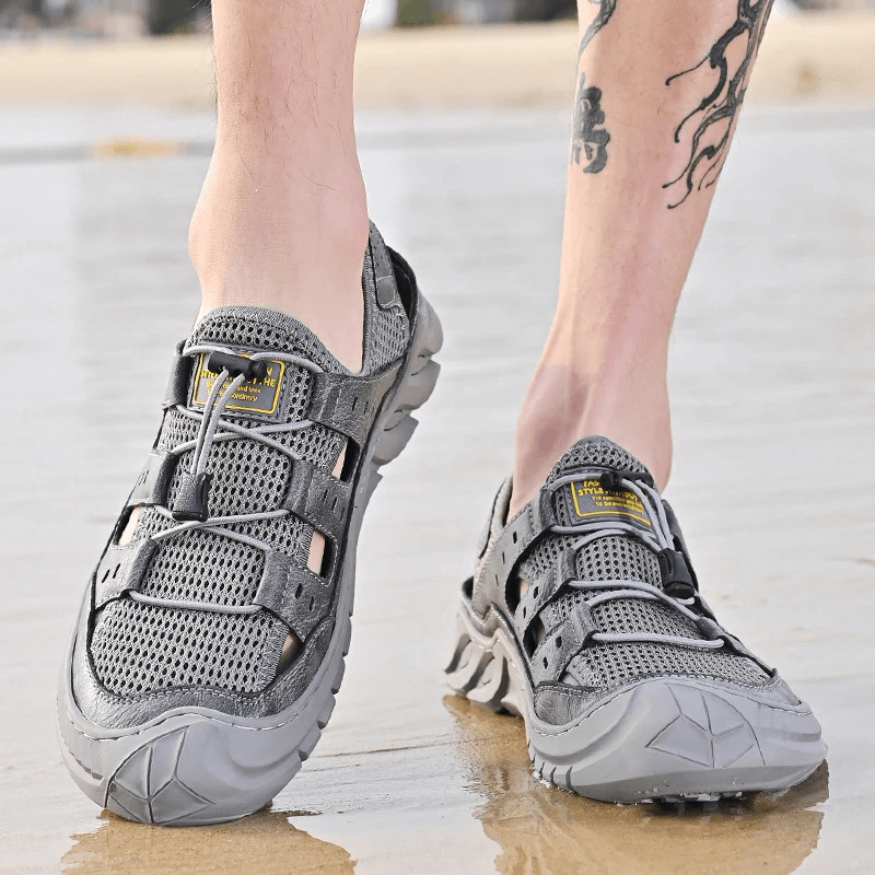 Hollow-Out Breathable Mesh Sandals with wear-resistant rubber sole, perfect for beach adventures and stylish comfort.