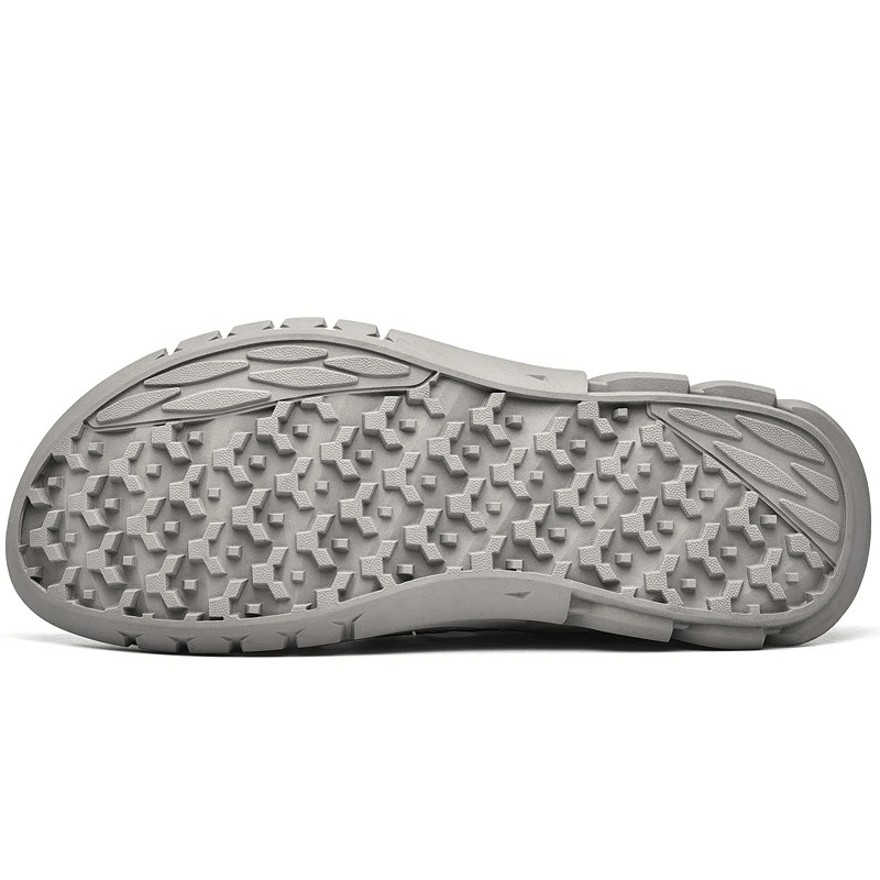 Grey rubber sole of the Hollow-Out Breathable Mesh Sandals showing wear-resistant tread pattern.